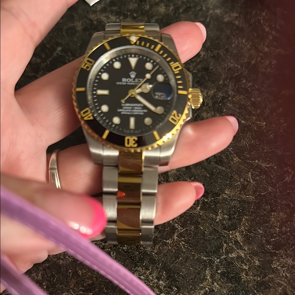 Rolex Black Dial with Gold and Silver Accents